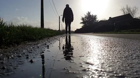 Walkingpersonpuddle Stock Footage 138261055