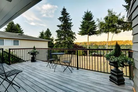 Walkout deck overlooking backyard area Stock Photos
