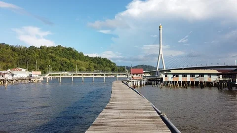 Walkthrough Kampung Ayer or water village with boat pass through Stock Footage 101091179