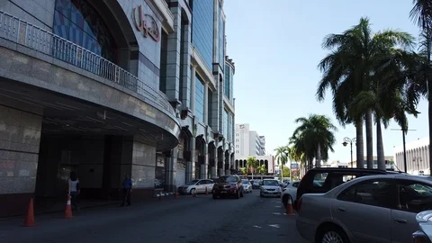Walkthrough pathway with car pass by one of Gadong road. Stock Footage 105401517