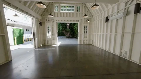 Walkthrough of a white house, event barn, and bedroom Stock Footage 345696597