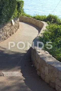 Walkway along a coast Stock Photos