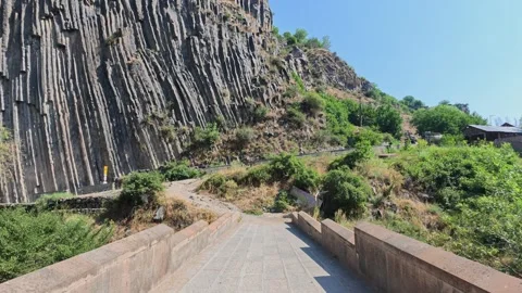 Walkway ascends toward striking hexagonal rock structures Stock Footage 341776041
