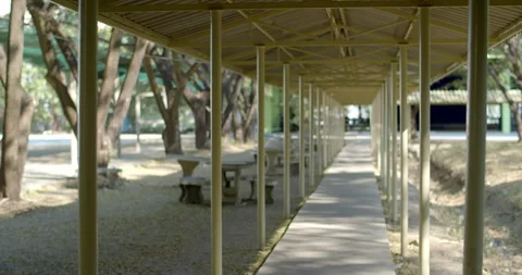 A walkway for a school built to protect students from the sun and rain. Stock Footage 316591860
