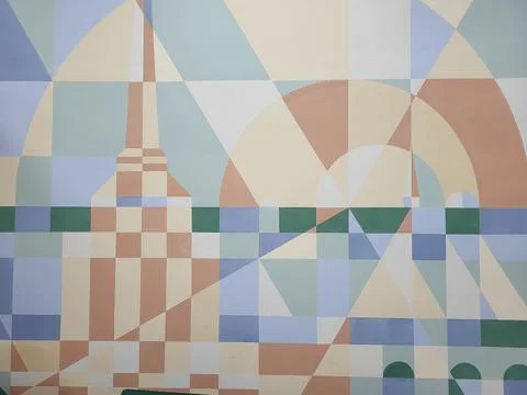 A wall with an abstract pattern of squares diamonds circles. Foto stock