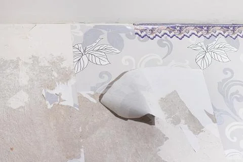 The wall after removing the wallpaper. Stock Photos