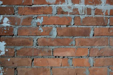 Wall of aged bricks and cement texture background image close up without peop Stock Photos