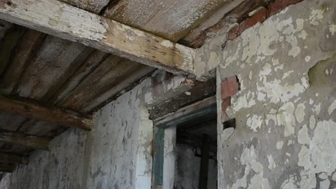 Wall and part of the ceiling of an abandoned building Stock Footage 138515702
