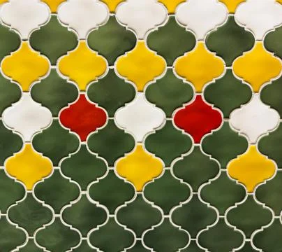 Wall background, A tile pattern with green, yellow, and white tiles Stock Photos