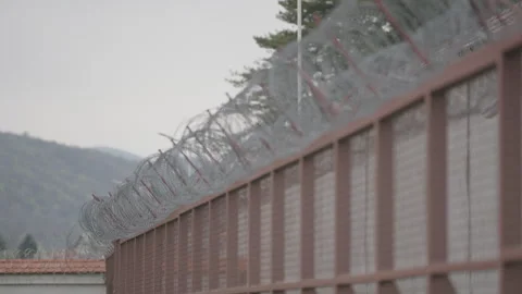 Wall with barb wire Lepoglava prison croatia Stock Footage 245144869
