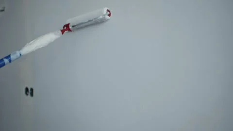 Wall being painted with paint roller Stockbeeldmateriaal 312227082