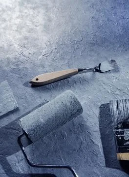 Wall blackground with paint roller Stock Photos