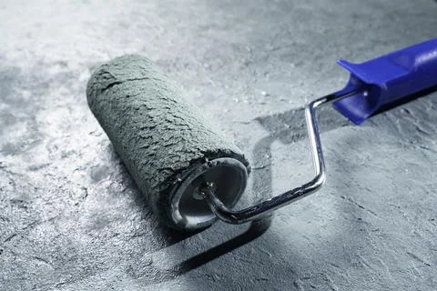 Wall blackground with paint roller Stock Photos