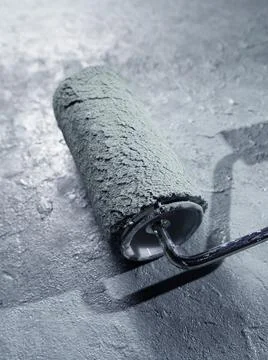 Wall blackground with paint roller Stock Photos
