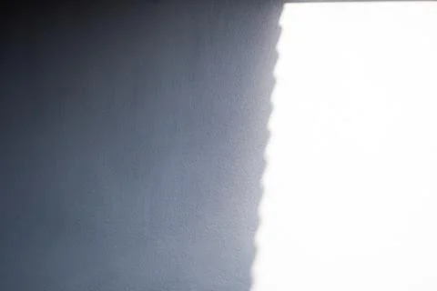 A wall with a blue and white pattern Stock Photos