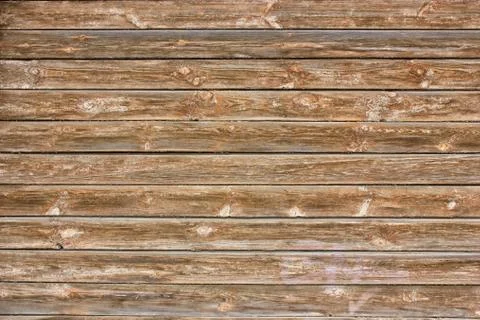 The wall of boards of an old building. Texture down time wood Fotos de archivo