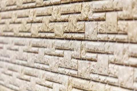 A wall with a brick pattern is shown in a close up Stockfoto's