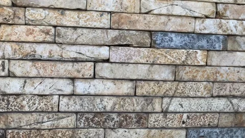 Wall of brick, Textured Beige Stone Wall with Natural Cracks and Aging Stains Stock Footage 312275507