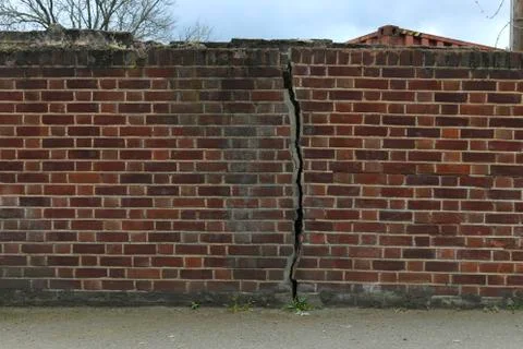 Wall bricks crack, background. Stock Photos