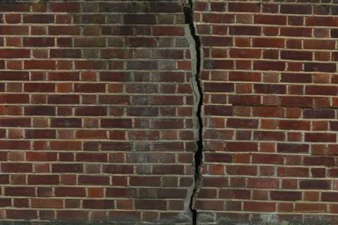 Wall bricks crack, background. Stock Photos