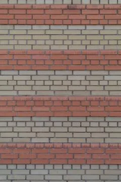 Wall of bricks with earth tones Stock Photos