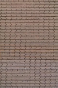 Wall of bricks with earth tones Stock Photos