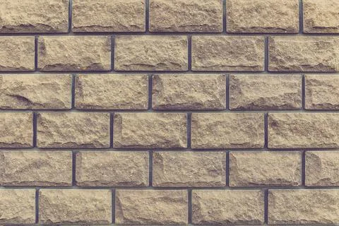 Wall of brown brick. close-up. background Stock Photos