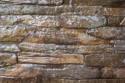 Wall brown stone texture background Stock Photos
