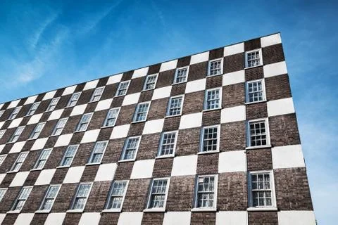 Wall with brown white checker pattern design Stockfoto's