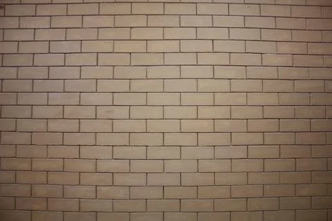 A wall of a building made from interlocked bricks 스톡 사진