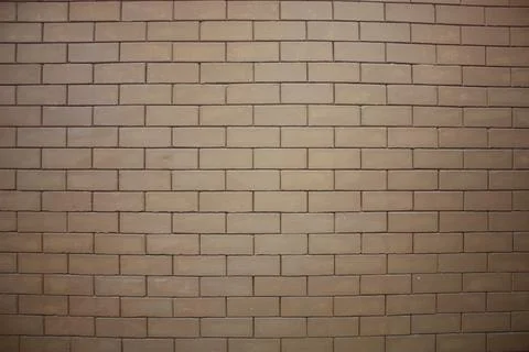 A wall of a building made from interlocked bricks 스톡 사진