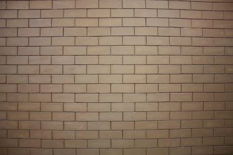 A wall of a building made from interlocked bricks 스톡 사진