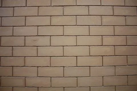 A wall of a building made from interlocked bricks 스톡 사진