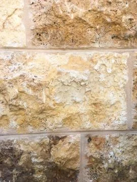 The wall of the building. The texture of the stone. Stock Photos
