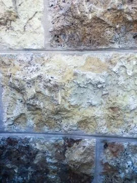 The wall of the building. The texture of the stone. Stock Photos