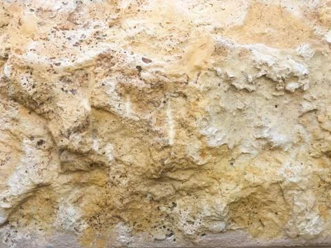 The wall of the building. The texture of the stone. Stock Photos