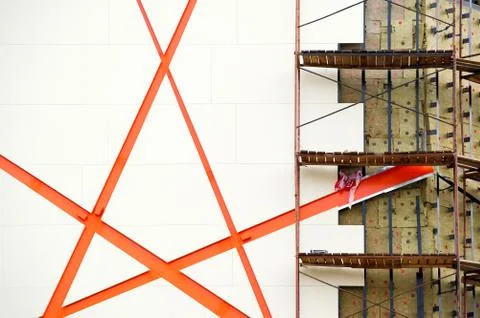 Wall of a building under construction. Border of finished part and draft. Hal Stock Photos