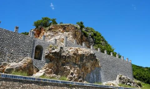 A wall built around a cliff face Stock Photos