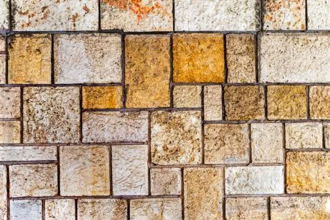 Wall built of natural stone. Stock Photos