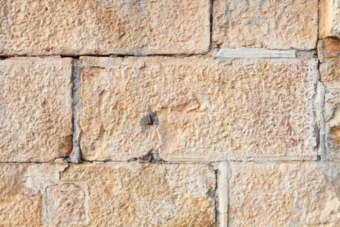 Wall built of rectangular sandstone bricks Stock Photos