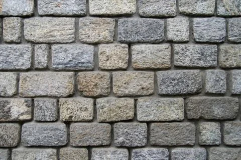A wall built of stones. Stock Photos