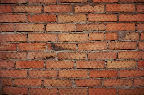A wall of burnt brick Stock Photos