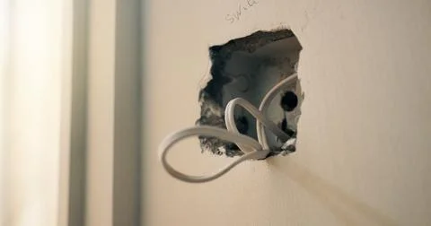 Wall, cable and fitting with outlet for electrical work, protection or wiri.. Stock Photos