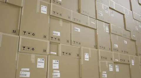 Wall of Cardboard Boxes For Package, Pile, Shipping and Delivery, With Signs Ilustración de archivo
