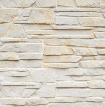 Wall of carved limestone bricks Stock Photos