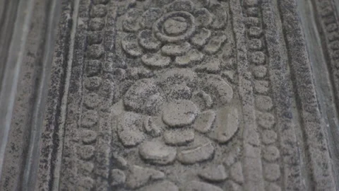 Wall carving flower pattern tilt down ta prohm Stock Footage 226950597