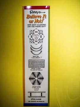 Wall chart with a series of optical illusion diagrams challenging the viewer Stock Photos