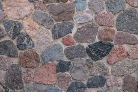 Wall of chipped stone. Close-up. 写真素材