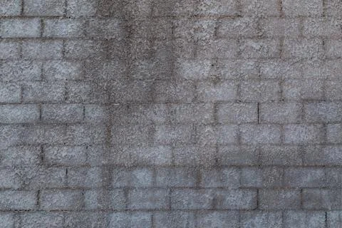 Wall of cinder blocks covered with a layer of shagreen concrete plaster Stock Photos