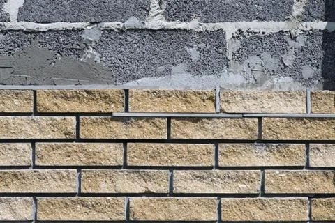 Wall cladding with decorative bricks, front view. Material for decorating the Fotos Stock